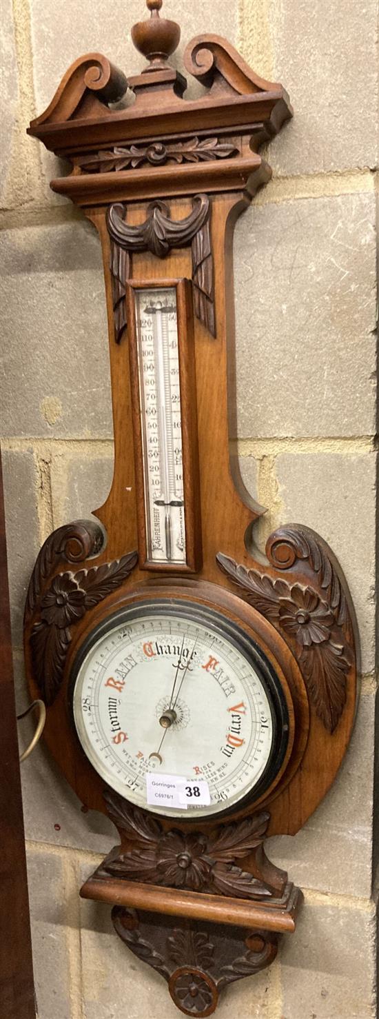 An Edwardian walnut aneroid wheel barometer / thermometer, height 98cm